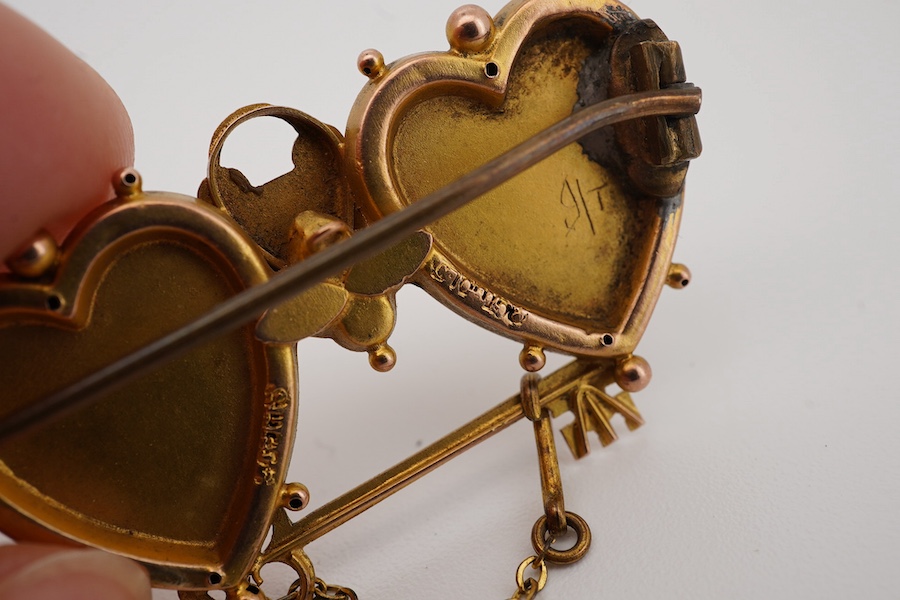 A group of jewels, comprising: a late 19th century 'Mizpah' brooch, stamped 9CT; a 9ct gold ring, British hallmark; a ruby and diamond ring, partial British hallmarks; a diamond stick pin, stamped 15CT, an aquamarine sti